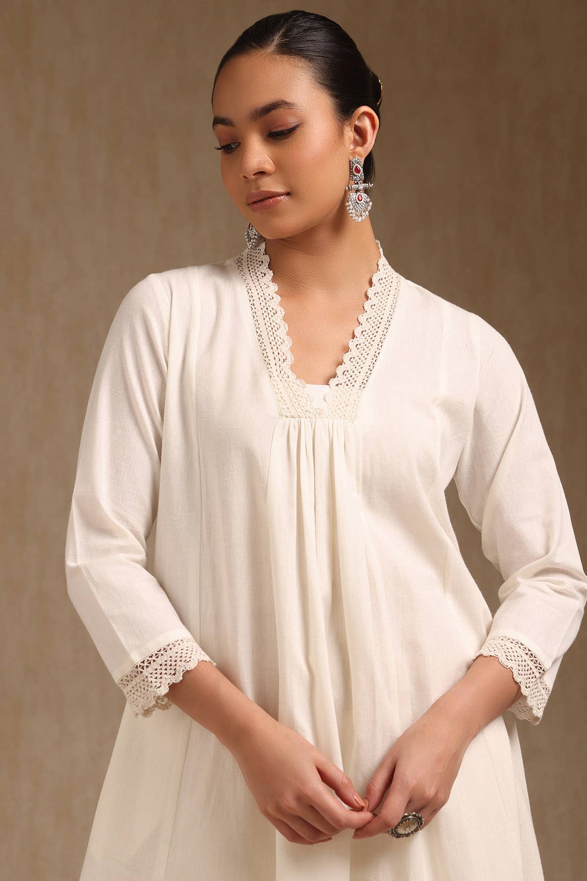 Off White Cotton Solid V-Neck Lace Inserts A-Line Kurta With Front Pleats - Image 1